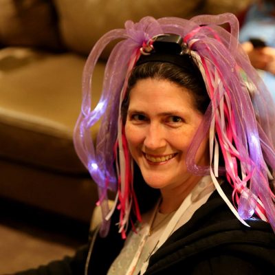 Penguicon-goer with pink light up wig